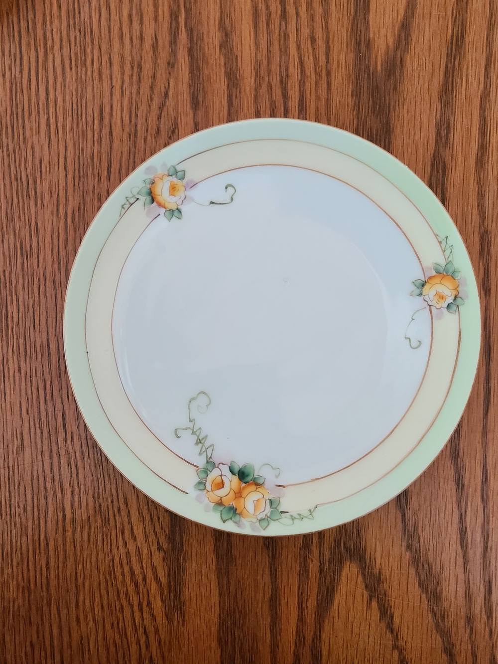 Vintage Meito China bread and butter plate, featuring hand-painted yellow roses